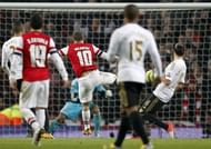 Arsenal's Jack Wilshere (C) scores at the Emirates Stadium in London on January 16, 2013